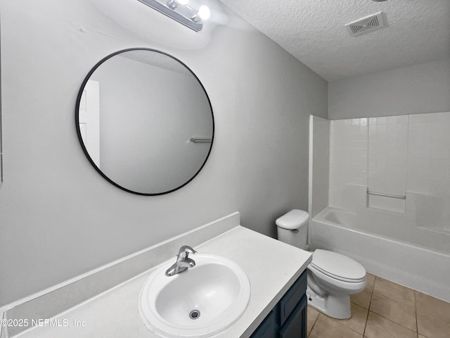 full bathroom featuring shower / bath combination, vanity, toilet, tile patterned floors, and a textured ceiling