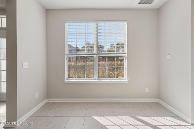 tiled empty room with plenty of natural light