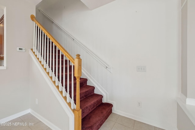 staircase with tile patterned flooring