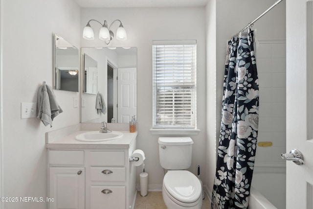 full bathroom featuring vanity, shower / tub combo with curtain, tile patterned floors, and toilet