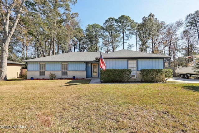 ranch-style home with a front lawn