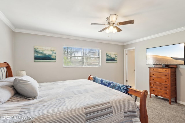 carpeted bedroom with ornamental molding and ceiling fan