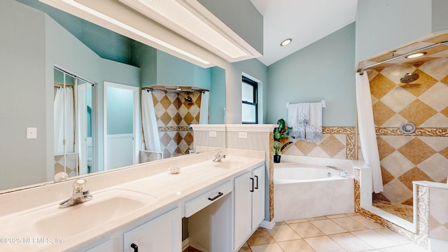 bathroom with a stall shower, a sink, a bath, and tile patterned floors