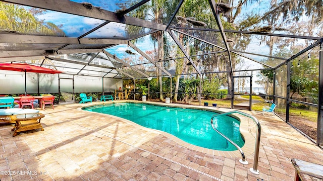 outdoor pool with a patio and a lanai