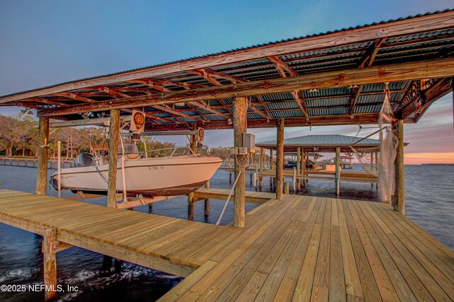 view of dock featuring a water view and boat lift