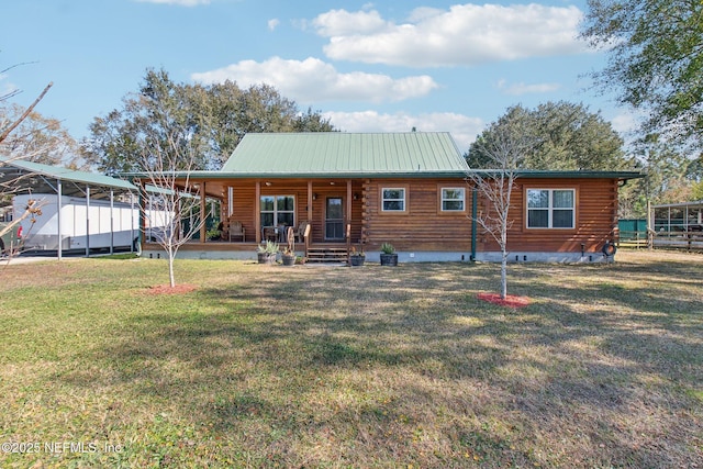 rear view of house featuring a yard and covered porch