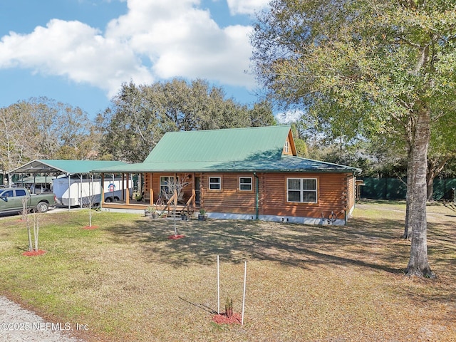 cabin with a front yard