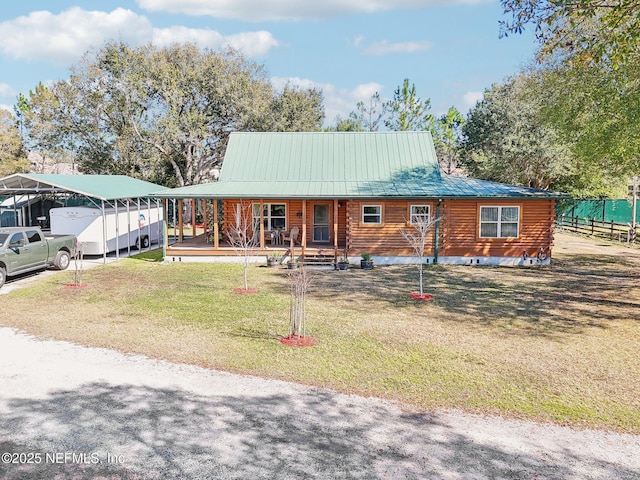 view of front of house with a carport, a porch, and a front yard