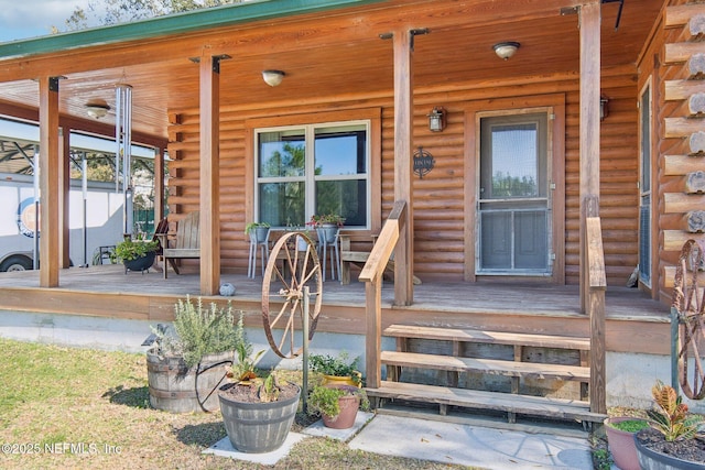 doorway to property with covered porch