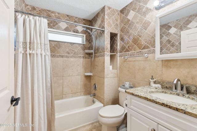 full bathroom with shower / bath combo, tile walls, vanity, a textured ceiling, and toilet