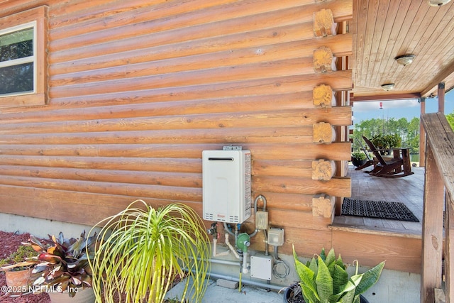 exterior details featuring tankless water heater