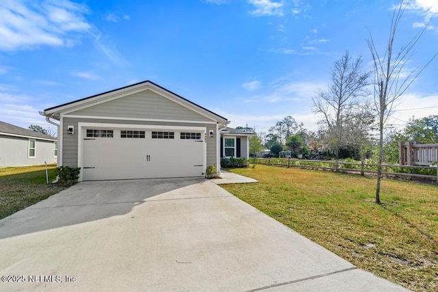 view of front of home with a garage and a front yard