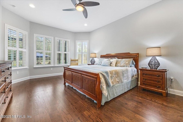 bedroom with dark hardwood / wood-style flooring and ceiling fan