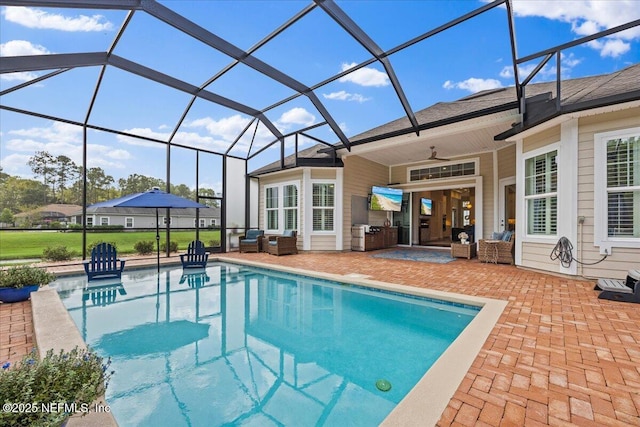 view of pool featuring ceiling fan, a patio, and glass enclosure