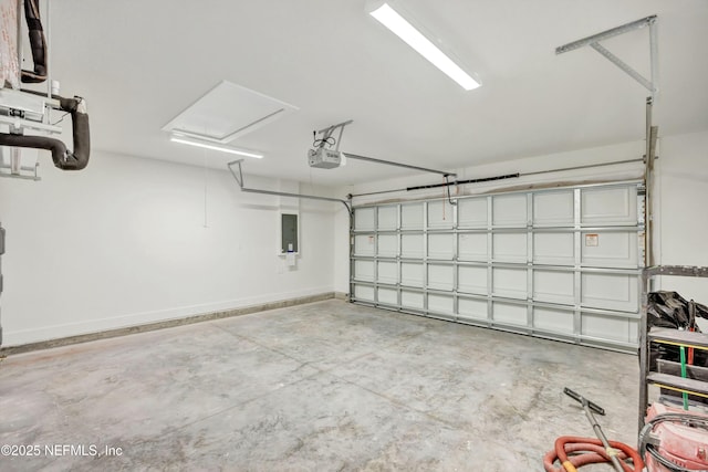 garage featuring a garage door opener and electric panel