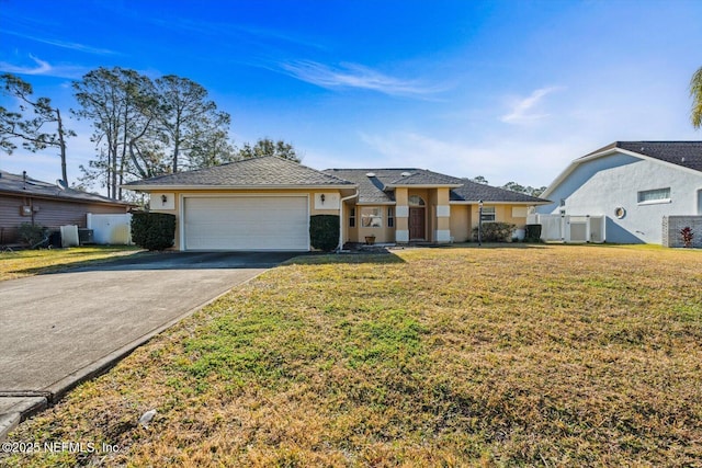 ranch-style home with central AC, a garage, and a front yard