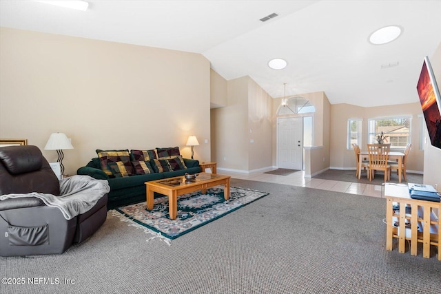 living room featuring light colored carpet and lofted ceiling