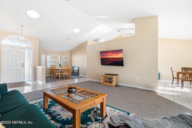 tiled living room featuring lofted ceiling