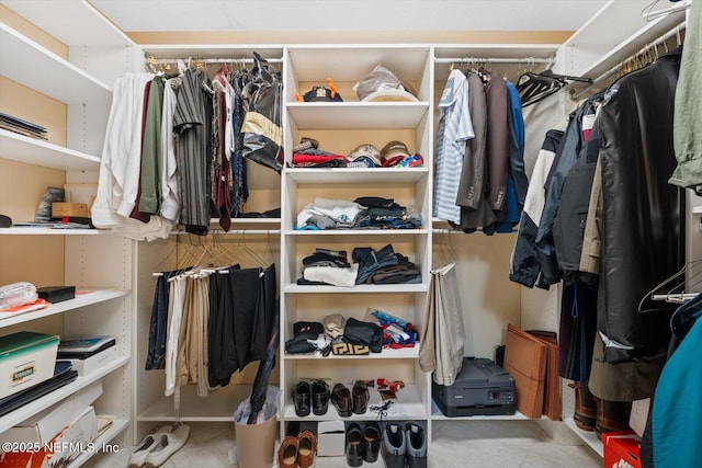 walk in closet featuring light tile patterned floors