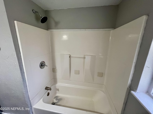 bathroom with shower / tub combination