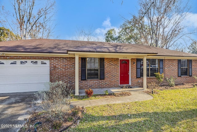 single story home with a garage and a front lawn