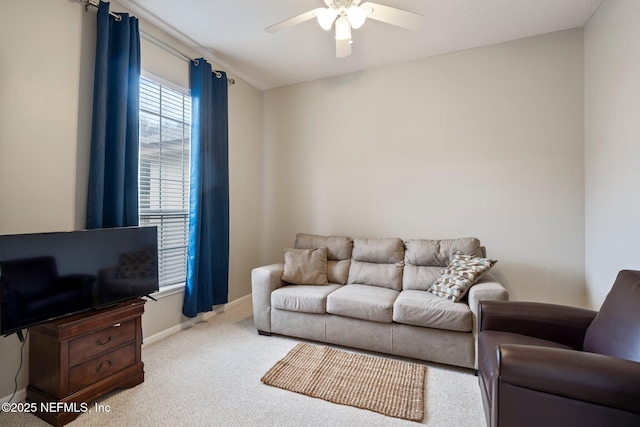 living room featuring ceiling fan and light colored carpet