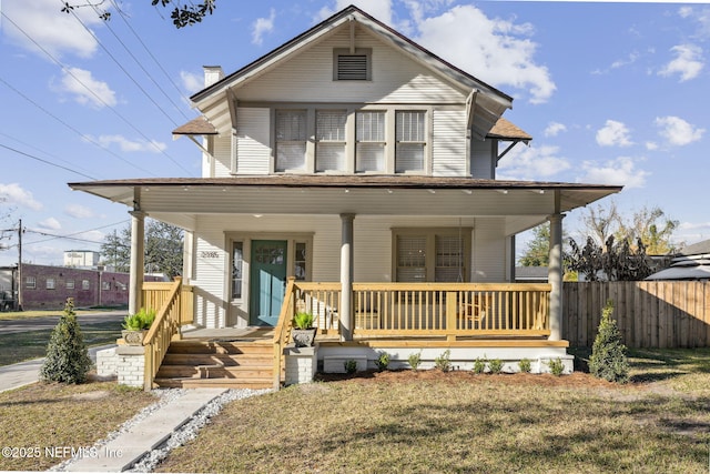 view of front of house featuring a porch and a front lawn