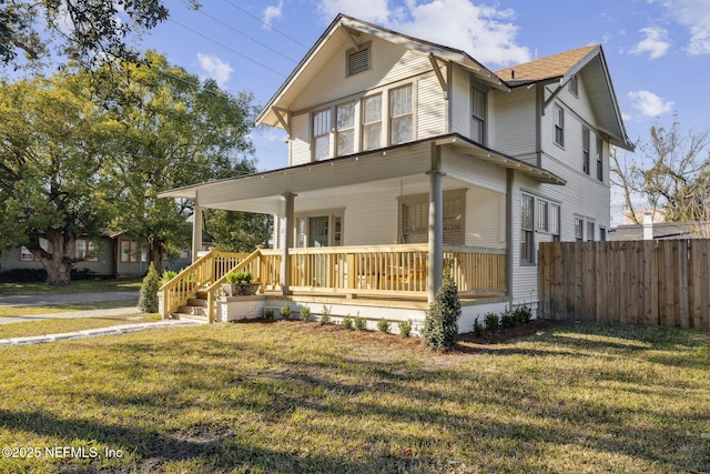 view of front of home with a porch and a front yard