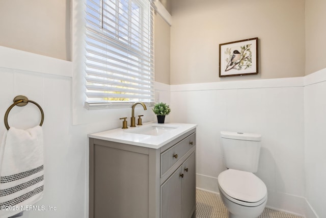 bathroom featuring vanity and toilet