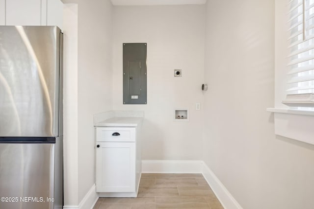 washroom with hookup for a washing machine, electric panel, and hookup for an electric dryer