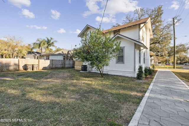 exterior space with a yard and central AC unit