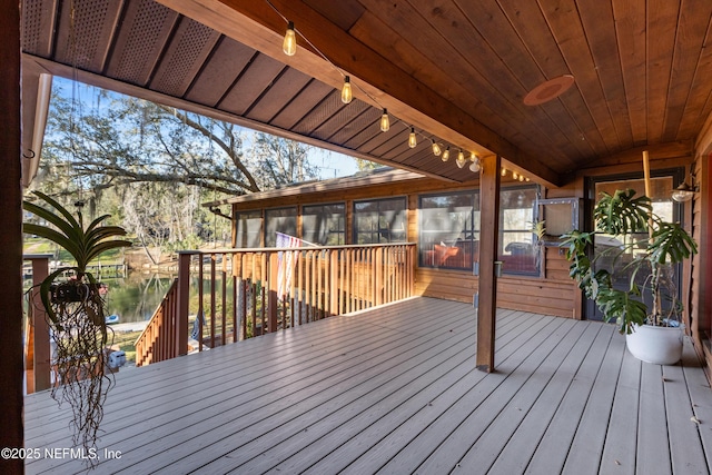 wooden terrace with a water view