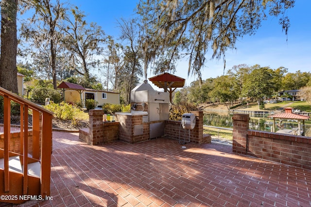 view of patio / terrace featuring a water view