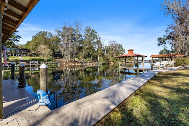 dock area featuring a gazebo and a water view