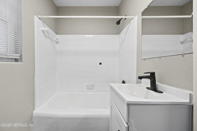 bathroom with vanity and bathing tub / shower combination