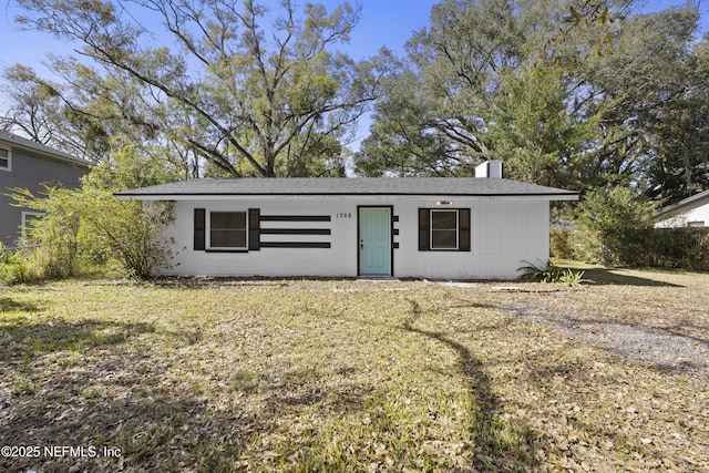 view of outbuilding featuring a lawn