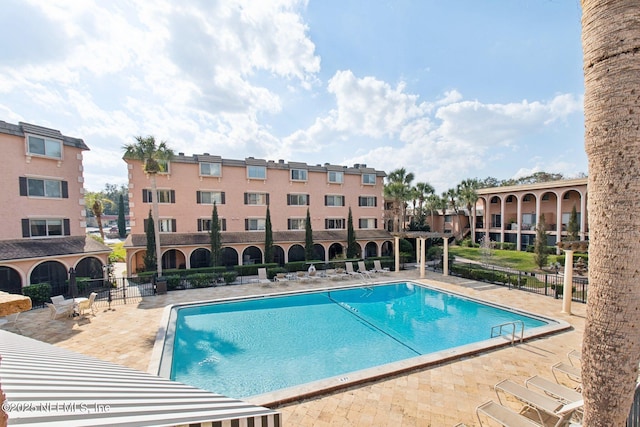 view of swimming pool with a patio