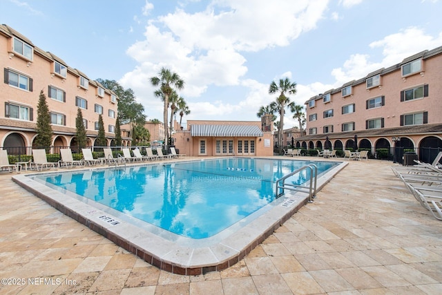 view of swimming pool with a patio