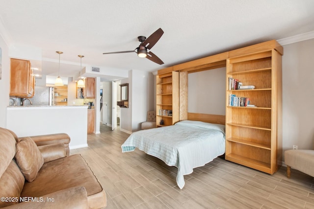 bedroom with stainless steel refrigerator and ceiling fan