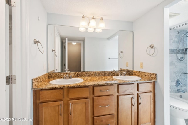 full bathroom featuring shower / tub combination, vanity, and toilet