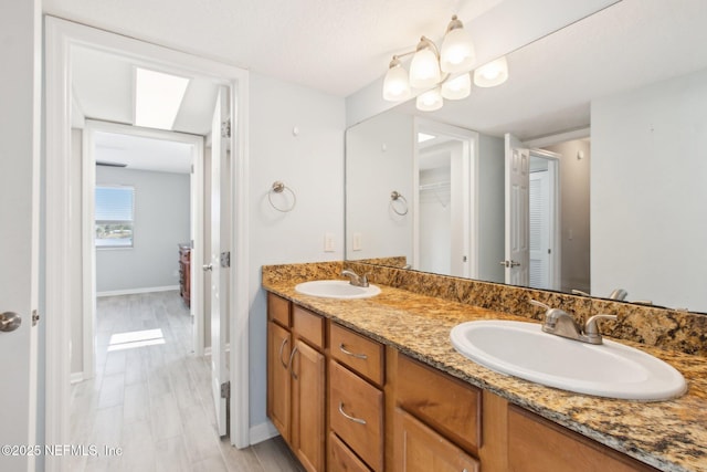 bathroom featuring vanity and wood-type flooring