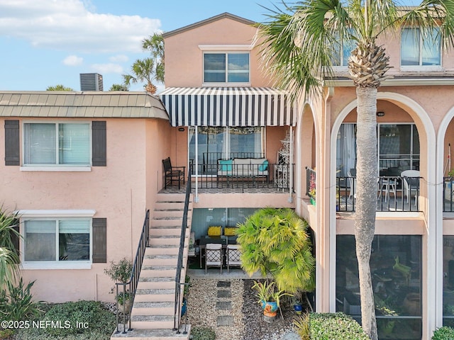 view of property featuring central AC unit