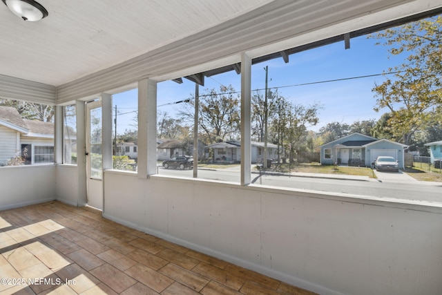 unfurnished sunroom with a healthy amount of sunlight