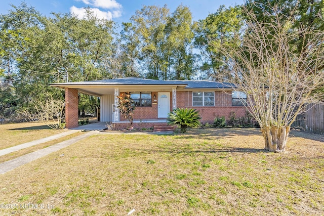 single story home featuring a carport and a front yard