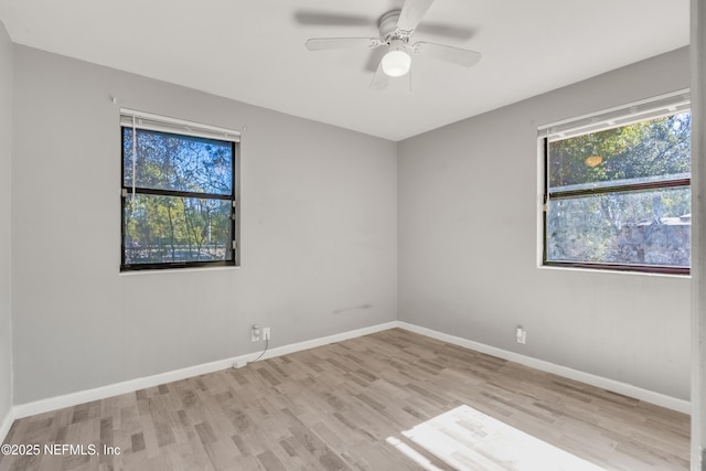 unfurnished room with ceiling fan and light wood-type flooring