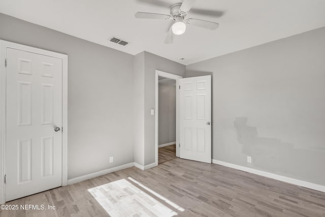 unfurnished bedroom with ceiling fan and light hardwood / wood-style flooring