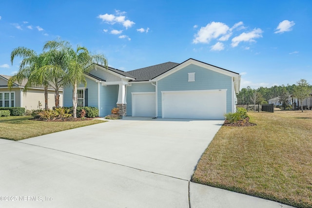 view of front of property featuring a garage and a front yard