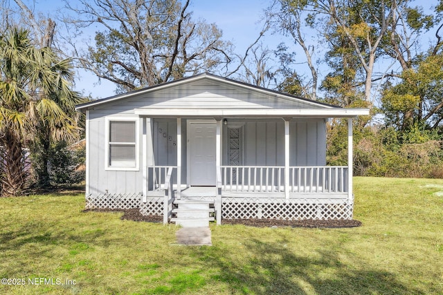 view of front of house featuring a front yard and covered porch