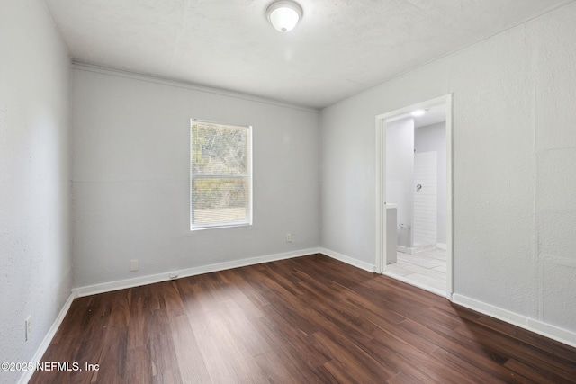 empty room featuring wood-type flooring