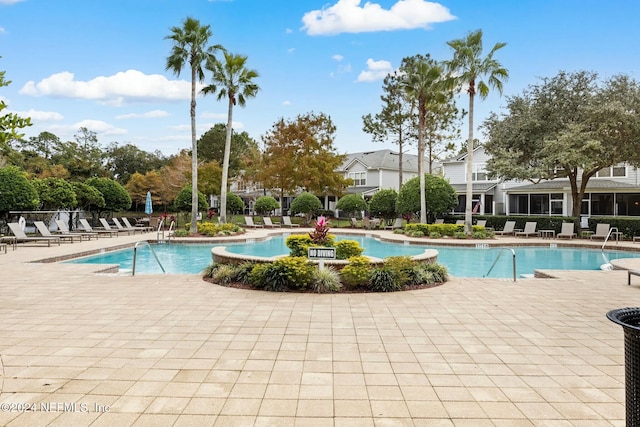 view of swimming pool featuring a patio area